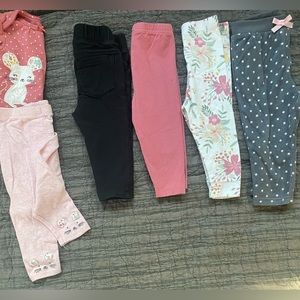 5 pair of pants one with the matching onesie. All size 12 months various brands.